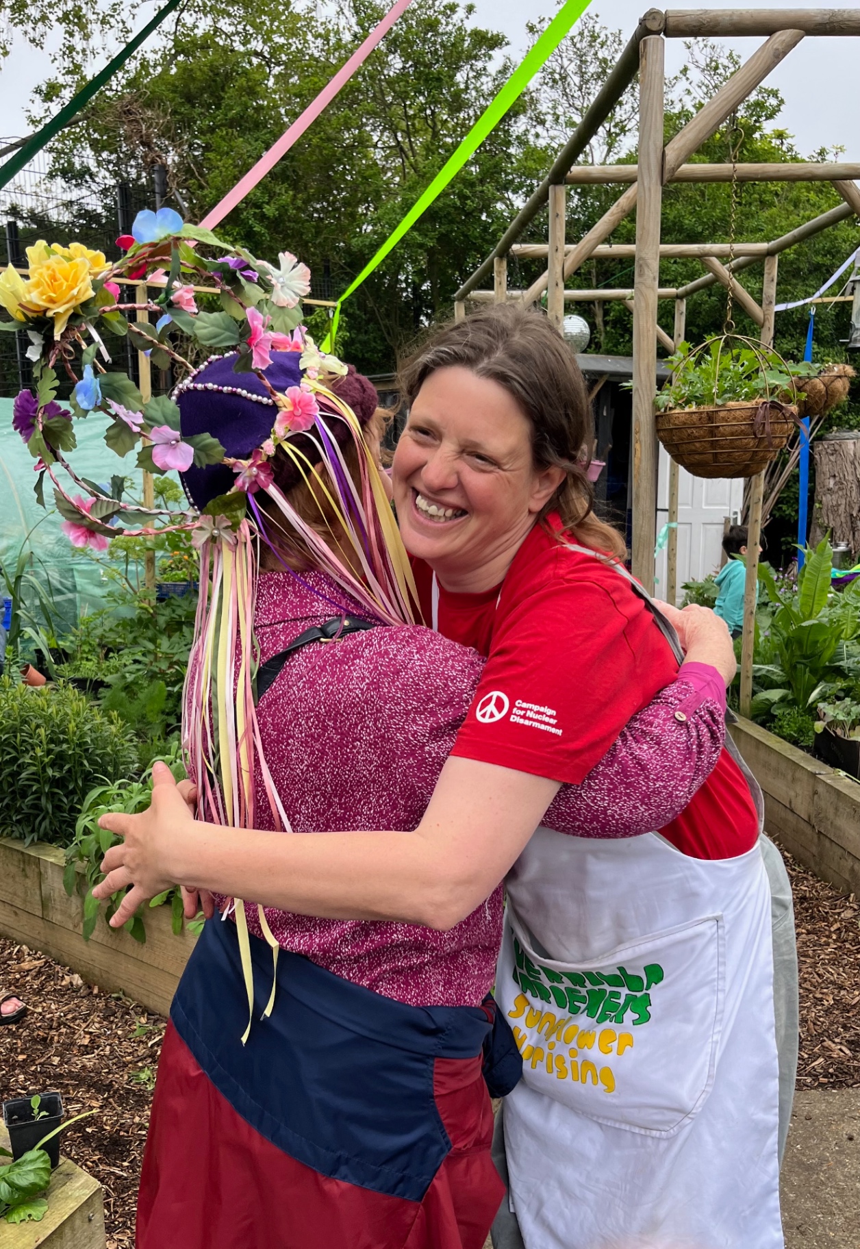 Lucy and Mandy hugging at the May Day celebration