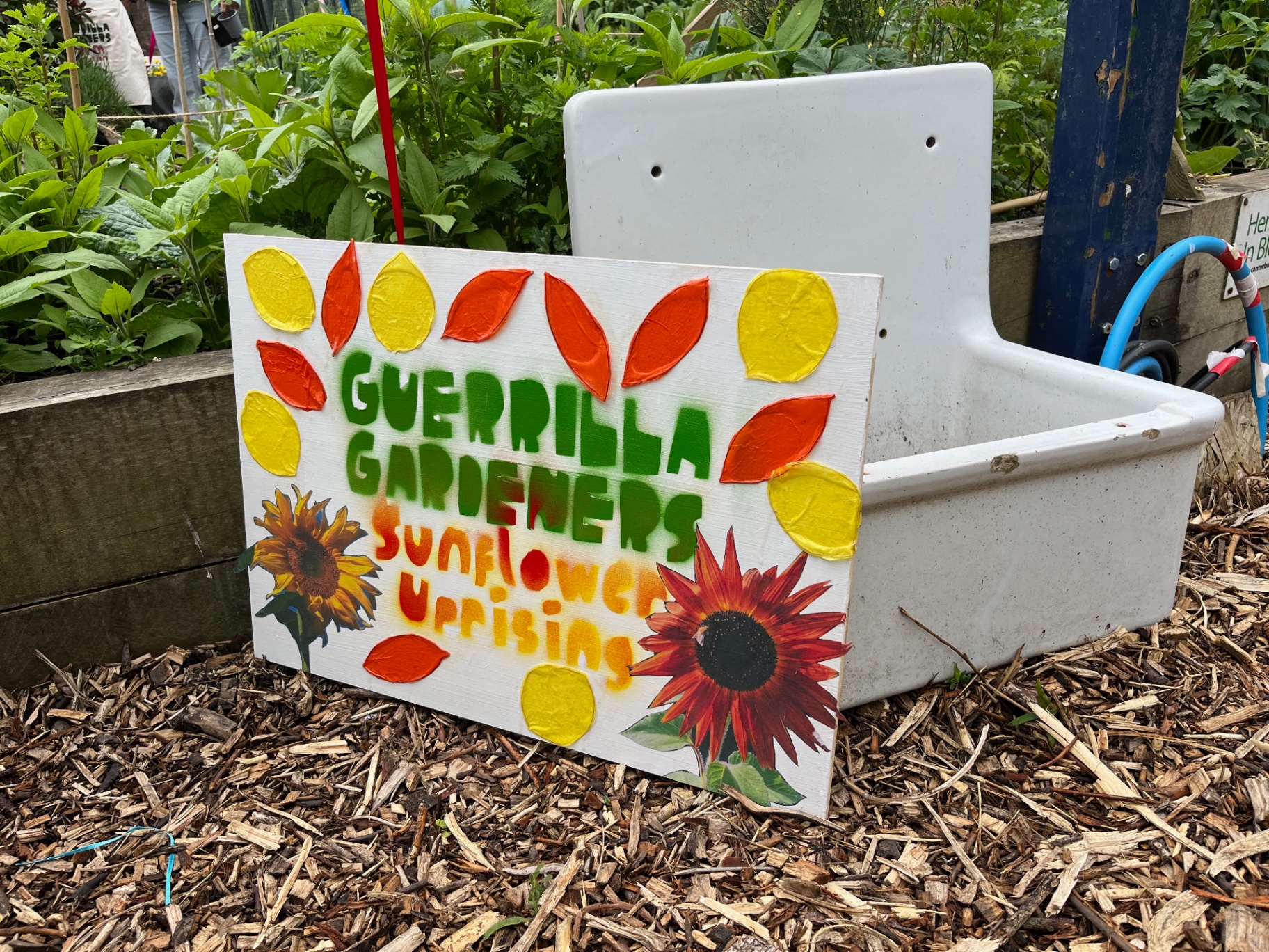 Hand-painted Guerrilla Gardeners Sunflower Uprising sign