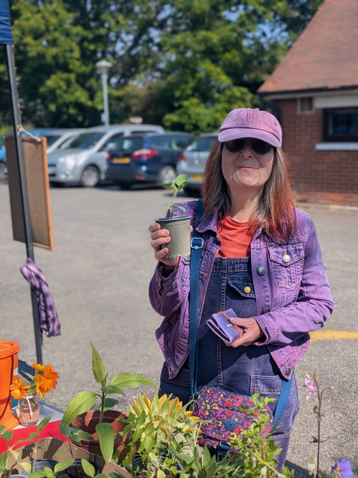 Sunflower ambassador grower Veronica with her new sunflower plant